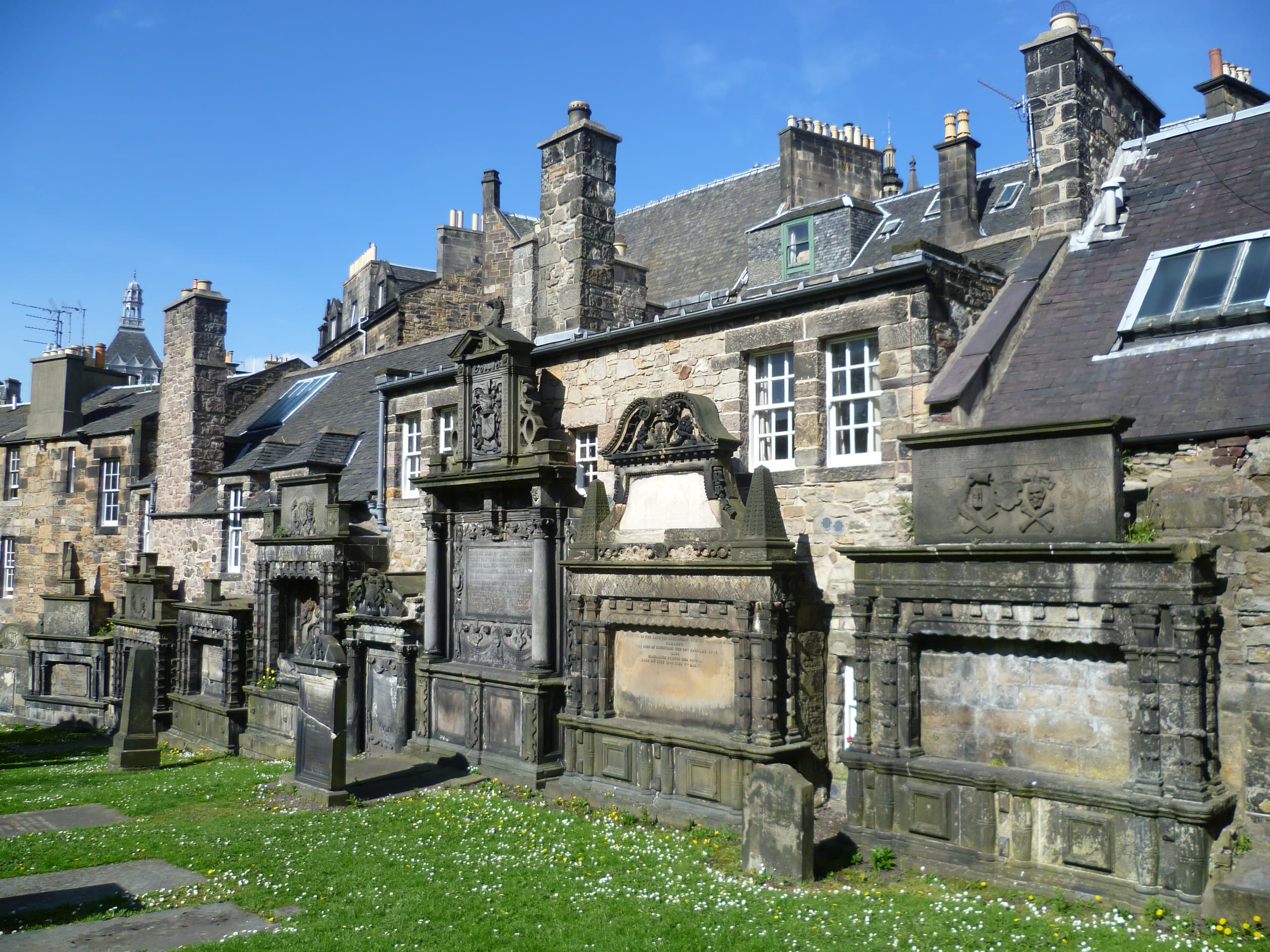 The dark stone wall of Greyfriars Kirkyard in Edinburgh