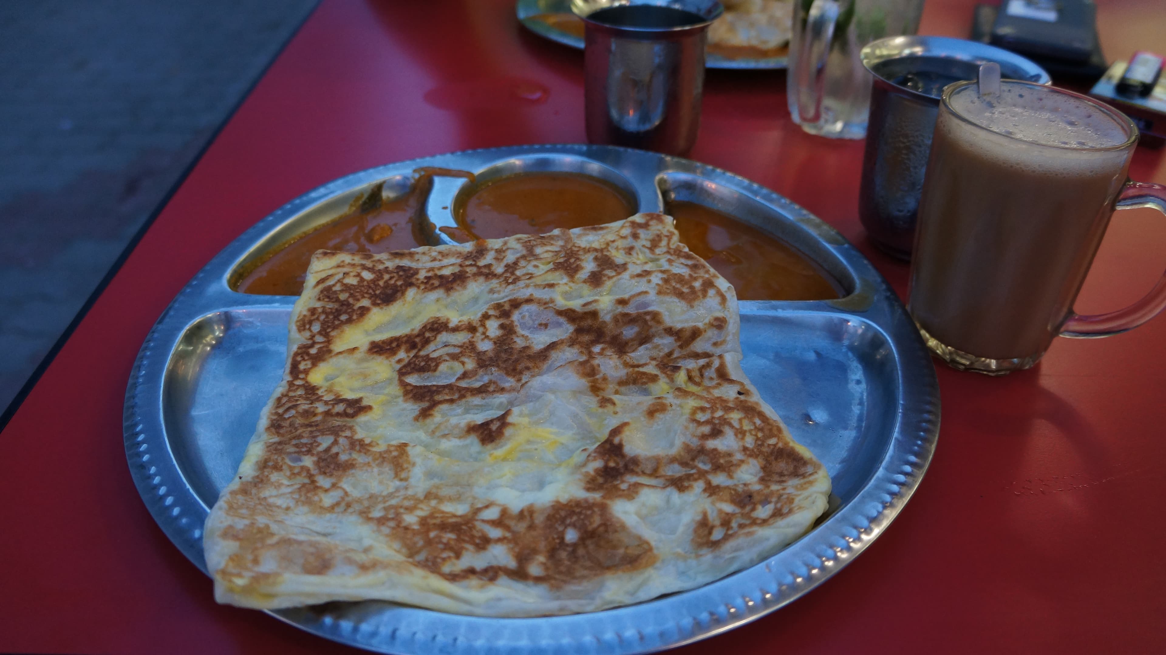 Roti telur served with teh tarik in Malaysia